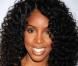 Kelly Rowland portait une robe à bandes noire scintillante Hervé Léger by Max Azria.Cheveux bouclés au naturel, elle était divine lors du lancement du livre About Face de Scott Barnes à l'Hôtel Provocateur à New York le 20 janvier 2010 