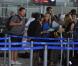 Le rubgyman français Christian Califano se prépare à embarquer pour l'aventure Pékin Express, à l'aéroport de Roissy, le 30 juillet 2010