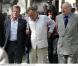 Bernard Kouchner, Règis Debray et Georges Kiejman, lors des obsèques d'Alain Corneau, au cimetière du Père-Lachaise, à Paris, le 4 septembre 2010.