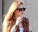 Lindsay Lohan sait très bien cacher sa mauvaise mine grâce à ses lunettes Ray-Ban. 