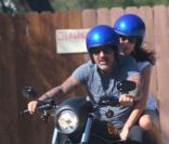 Christian Audigier en balade romatique en moto avec sa nouvelle petite amie Nathalie Sorensen, dans les canyons de Topanga, en Californie, le 4 mai 2011