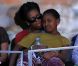 Michelle Obama s'est déplacée à Flushing Meadows vendredi 9 septembre 2011 pour le 12e jour de l'US Open. Elle a suivi la passe d'armes intense entre Andy Murray et John Isner avec sa fille Malia tendrement sur ses genoux. 