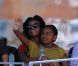 Michelle Obama s'est déplacée à Flushing Meadows vendredi 9 septembre 2011 pour le 12e jour de l'US Open. Elle a suivi la passe d'armes intense entre Andy Murray et John Isner avec sa fille Malia tendrement sur ses genoux. 