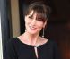 Carla Bruni-Sarkozy s'apprête à dîner dans le cadre du G8, à Deauville. Elle arbore une petite robe noire et une minaudière. Mai 2011 