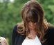 Carla Bruni-Sarkozy dévoile pour la première fois son ventre rond dans une petite robe blanche chic ! Deauville, mai 2011 