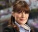 Carla Bruni, quelques jours avant l'annonce de sa grossesse au G8. Elle est chez TF1, son ventre n'est pas visible. Le plan télé est coupé à la taille. Mai 2011 