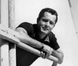 John Derek en 1956.