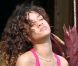 Rihanna, plongée dans ses pensées lorsqu'elle fume une cigarette roulée des plus suspicieuses durant ses vacances à Hawaï le 15 janvier 2012