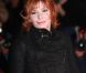 Mylène Farmer sur le tapis rouge des 13e NRJ Music Awards, le 28 janvier 2012 à Cannes. Malgré une météo peu clémente et quelques gouttes, les invitées de l'événement ont offert un spectaculaire défilé.