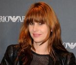 La jolie rousse Cécile Togni, du duo Les Putes à Franges, était à l'ouverture de la boutique Emporio Armani à Paris, le 2 février 2012.