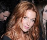 L'actrice Poppy Montgomery, à côté du mannequin Coco Rocha lors du défilé Hervé Léger by Max Azria automne-hiver 2012/2013 à New York, le 11 février 2012.