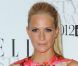 Poppy Delevigne était la touche couleur des Elle Style Awards, avec cette robe aux motifs fleuris signée Mary Katrantzou pour Topshop. Londres, le 13 février 2012. 