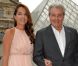 Anouchka Delon, au bras de son père Alain Delon, assiste au défilé Croisière 2013 de Salvatore Ferragamo à la Galerie Denon au Louvre. Paris, le 12 juin 2012.