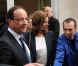 François Hollande et Valérie Trierweiler lors de la vente aux enchères exceptionnelle des toiles de Florence Cassez, à Paris, le 16 juin 2012.