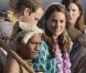 Kate Middleton escortée par des guerriers en tenues traditionnelles lors de son arrivée le dimanche 16 septembre 2012 à l'aéroport Henderson à Honiara aux Iles Salomon, troisième étape de leur voyage en Asie du sud-est dans la cadre du Jubilé de diamant de la reine Elizabeth II