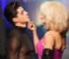 Amanda Lear joue de ses charmes avec un beau mannequin lors du défilé prêt-à-porter printemps-été 2013 de Jean-Paul Gaultier. Paris, le 29 septembre 2012.
