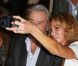 Alain Delon et son ex-compagne Rosalie Van Breemen très unis au défilé Elie Saab aux Tuileries à Paris, le 3 octobre 2012.