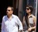 Petite promenade sur le port varois... Eric Besson et sa femme Yasmine profitant d'une nouvelle journée de farniente et de tendresse à Saint-Tropez, le 13 juillet 2012.