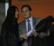 Eric Besson et sa femme Yasmine dans les travées du Stade de France le 11 octobre 2011 à Saint-Denis lors du match entre l'équipe de France et la Bosnie
