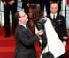 François Hollande et les filles de l'équipe de basket lors de la cérémonie de remise de la Légion d'honneur aux sportifs médaillés à Londres lors des Jeux olympiques, au palais de l'Elysée le 1er mars 2013 à Paris