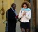Teddy Riner et sa compagne Luthna lors de la cérémonie de remise de la Légion d'honneur aux sportifs médaillés à Londres lors des Jeux olympiques, au palais de l'Elysée le 1er mars 2013 à Paris