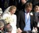 Le prince William et la duchesse de Cambridge Kate Middleton, enceinte, assistent au mariage de Laura Bechtolsheimer avec Mark Tomlinson, ici à la sortie du temps protestant, à Arosa en Suisse, le 2 mars 2013.
