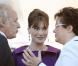 Didier Barbelivien, Carla Bruni-Sarkozy et Christine Boutin, à Paris, le 14 juillet 2008.