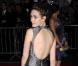 Emmy Rossum dans une robe version sirène avec dos nu, lors de la soirée organisée au Metropolitan Museum of Art de New York par le Costume Institute, le 4 mai 2009