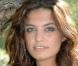 Laetitia Milot : La beauté de Mélanie est aussi rafraîchissante que le vent du Mistral. Avec ses yeux verts et sa chevelure de rêve, c'est la P'tite Bombe de Plus Belle La Vie !