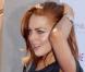Quand Lindsay Lohan veut faire sa vampe devant les photographes, elle opte pour la main passée délicatement dans ses cheveux ! Pour être la plus sensuelle des starlettes, LiLo met le paquet...