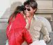 Tom Cruise et Katie Holmes sortent d'un spectacle, à Broadway. Suri Cruise est à leurs côtés, et porte ses chaussures à talons ! Mai 2010