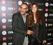 Christian Audigier et sa nouvelle compagne Isha, à la soirée FIFA au VIP Room à Paris, le 11 octobre