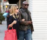 Heidi Klum opte pour Seal à son bras gauche et pour le Rosabel en rouge qui s'affiche sur son bras droit.  