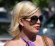 Très apprêtée, Tori Spelling fait une balade en famille au centre commercial Country Mart de Malibu, le 28 mai 2011. 