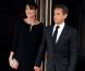 Carla Bruni-Sarkozy cache ses rondeurs de future maman dans une robe ample et noire. Ravissant et très élégant. Deauville, 26 mai 2011 