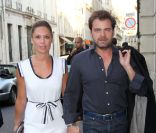 Clovis Cornillac et Lilou Fogli (en Alexis Mabille et accessoires Roger Vivier) en arrivant à la soirée de lancement de la collection Signature de Tod\'s. A l\'Ambassade d\'Italie à Paris, le 2 octobre 2011