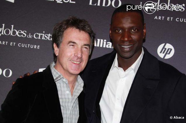 Omar Sy et François Cluzet à la cérémonie des Globes de cristal, au Lido à Paris, le 6 février 2012.