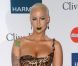 Amber Rose pose sur le tapis rouge, lors de la soirée des Pre-Grammy, le samedi 11 février 2012 à Los Angeles.