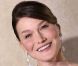 Carla Bruni, souriante, au dîner d'état en l'honneur du président Ouattara, à l'Élysée, le 26 janvier 2012 à Paris