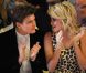 Pixie Lott et son petit ami Oliver Cheshire, amoureux complices pour applaudir la collection automne-hiver 2012 de Temperley London. Londres, le 18 février 2012.