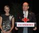 Le prince Albert II de Monaco pendant son discours et sa femme la princesse Charlene lors de la cérémonie de la Croix-Rouge, à Monaco, le 21 février 2012