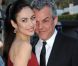 Olga Kurylenko présente la série  Magic City  en mars 2012 à Los Angeles, en compagnie de Danny Huston. 