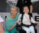 Le prince Albert et Charlene le 26 mai 2012 dans le paddock à la rencontre de personnes hadicapées à l'occasion du Grand Prix de Monaco