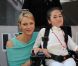 Le prince Albert et Charlene le 26 mai 2012 dans le paddock à la rencontre de personnes hadicapées à l'occasion du Grand Prix de Monaco