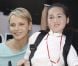 La princesse Charlene pose au côté d'une jeune fille handicapée rencontrée dans le paddock du Grand Prix de Monaco le 26 mai 2012