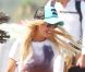 Tara Reid rayonnante le 24 juillet 2012, quelques jours après son hospitalisation en sortant du Club 55 à Saint-Tropez