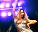  Clara Morgane, superbe et déchaînée, lors du concert "ON THE BEACH" à Liège durant lequel elle s'est produite aux côtés du DJ Jey Didarko, son mari, et de ses danseurs Harmony et Fabso le 2 août 2012. 