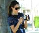 Emmy Rossum a une nouvelle passion : jouer la photographe devant les paparazzi. Le 15 août 2012