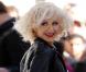 Christina Aguilera, moulée dans un minishort rouge lors d'une prestation live au Rockefeller Center pour le Today Show. New York, le 8 juin 2012.