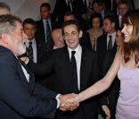 Nicolas Sarkozy et Carla Bruni-Sarkozy en visite d'Etat au Brésil, en décembre 2008, rencontrent le président Lula 